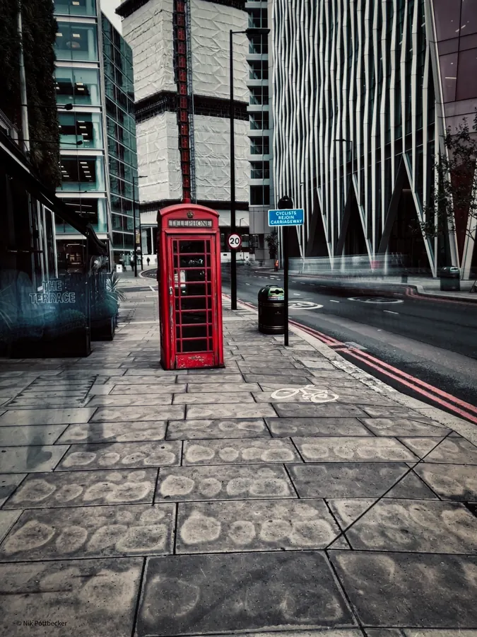 Red telephone box in a London street