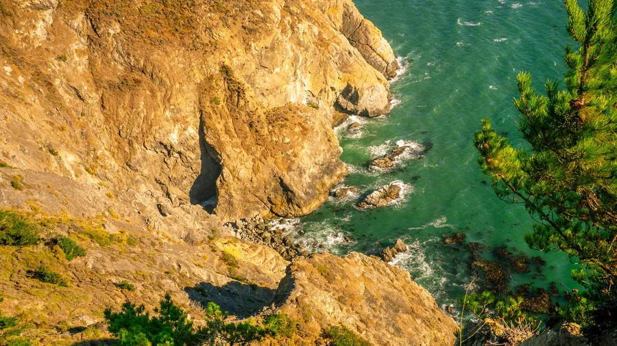 Rocky cliffs and turquoise water on the coast near San Francisco