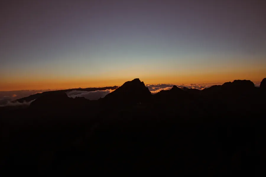 Mountain silhouettes after sunset above the clouds, Madeira