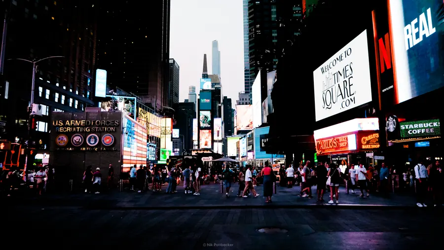 Times Square at dusk with illuminated billboards, New York
